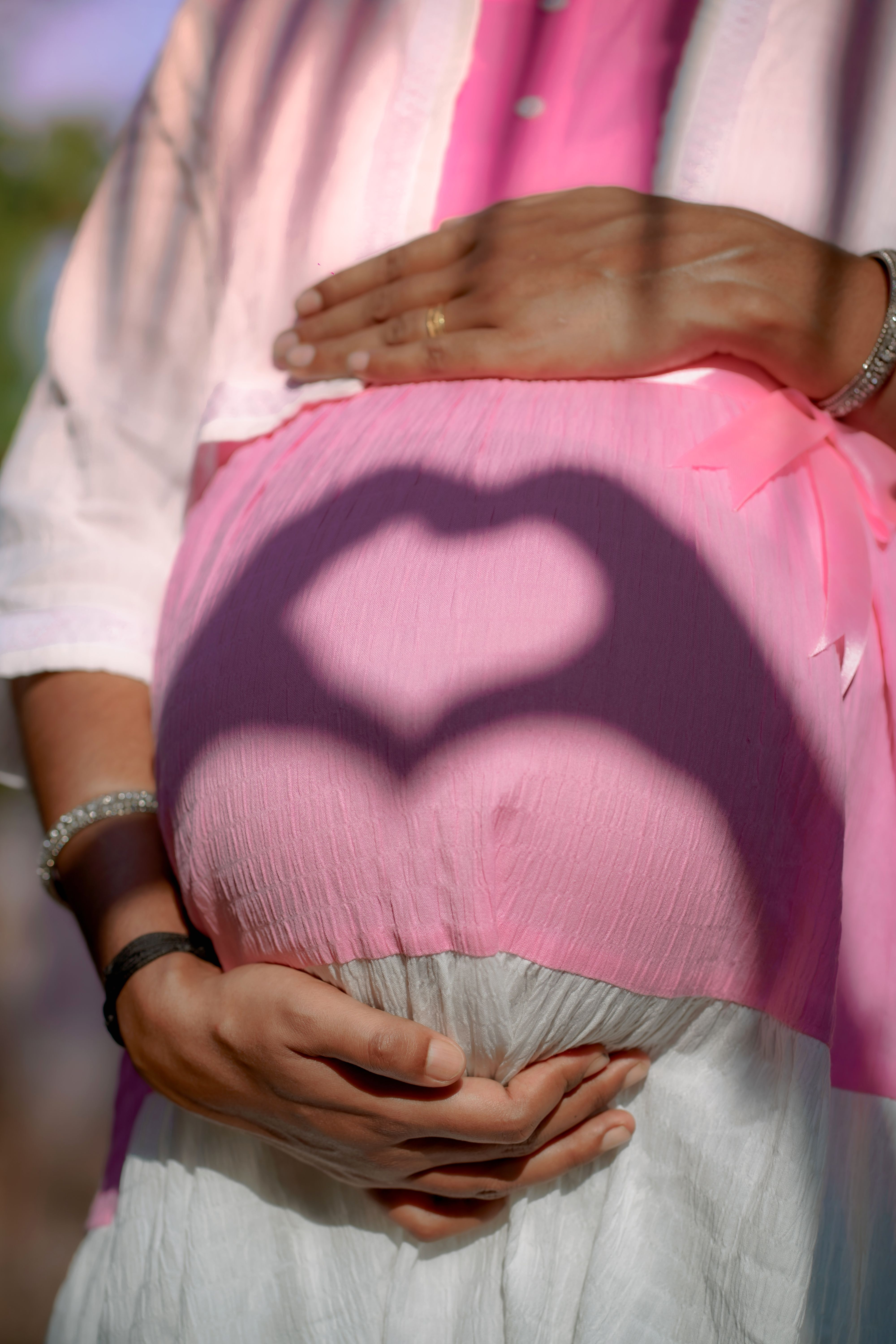 A pregnant professional in a black blazer